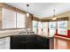 Kitchen features a double sink and an abundance of natural light at 1121 Paradise Dr, Lady Lake, FL 32159