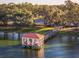 Scenic lakeside gazebo with wooden dock at 1121 Paradise Dr, Lady Lake, FL 32159