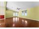 Bright living room with laminate wood floors and large windows at 1121 Paradise Dr, Lady Lake, FL 32159