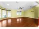Living room with laminate flooring and multiple windows at 1121 Paradise Dr, Lady Lake, FL 32159
