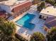 L-shaped pool with plenty of lounge chairs at 1121 Paradise Dr, Lady Lake, FL 32159