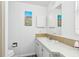 Clean bathroom with a single sink vanity and tiled floor at 12 Hilly Way, Fruitland Park, FL 34731