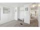 Simple bedroom with built-in shelving and a view of the kitchen at 12 Hilly Way, Fruitland Park, FL 34731