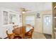Dining room features a round wooden table and chairs at 12 Hilly Way, Fruitland Park, FL 34731