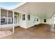 Covered carport and screened porch of manufactured home at 12 Hilly Way, Fruitland Park, FL 34731