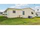 Mobile home exterior with a yard at 12 Hilly Way, Fruitland Park, FL 34731