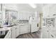Modern kitchen with stainless steel appliances, sleek countertops, and ample cabinet space at 12 Hilly Way, Fruitland Park, FL 34731