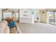 Open living area with a view into the kitchen and access to a patio at 12 Hilly Way, Fruitland Park, FL 34731