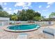 Community pool and spa with lounge chairs at 12 Hilly Way, Fruitland Park, FL 34731