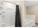 Bathroom with shower and garden tub at 12066 Callicarpa Ln, Leesburg, FL 34788