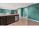 Kitchen with island and stainless steel appliances at 12066 Callicarpa Ln, Leesburg, FL 34788