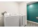 Laundry room with Samsung washer and dryer at 12066 Callicarpa Ln, Leesburg, FL 34788