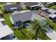 Charming single-story home with a well-manicured lawn and mature palm trees, creating a welcoming and picturesque setting at 1228 Zapata Pl, The Villages, FL 32159