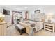Main bedroom with king-size bed and built-in shelving at 1228 Zapata Pl, The Villages, FL 32159