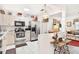 Bright kitchen with modern appliances, white cabinets, and an open layout, seamlessly connecting to the living area at 1228 Zapata Pl, The Villages, FL 32159