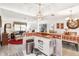 Kitchen features a white island and open concept to living room at 1228 Zapata Pl, The Villages, FL 32159