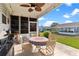Spacious patio with table, chairs, and a ceiling fan at 1228 Zapata Pl, The Villages, FL 32159