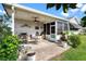 Covered patio with seating area, perfect for outdoor dining and entertaining at 1228 Zapata Pl, The Villages, FL 32159