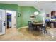 Bright dining room with a round table and four chairs, adjacent to kitchen at 15680 Se 84Th Ter, Summerfield, FL 34491