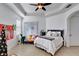 Spacious bedroom with a queen-size bed and sitting area at 15828 Starlite St, Clermont, FL 34714
