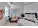 Well-lit bedroom with comfortable bed and access to patio at 15828 Starlite St, Clermont, FL 34714