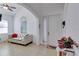 Inviting entryway with a charming couch and decorative elements at 15828 Starlite St, Clermont, FL 34714
