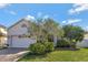 Attractive single-story home with a two-car garage and well-manicured lawn at 15828 Starlite St, Clermont, FL 34714