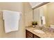 Clean bathroom with granite countertop, single sink and white towel at 15836 Starlite St, Clermont, FL 34714