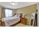 Charming bedroom with a full-size bed and wood nightstand at 15836 Starlite St, Clermont, FL 34714