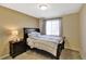 Cozy bedroom with a full-size bed and bedside table at 15836 Starlite St, Clermont, FL 34714
