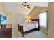 Bright bedroom with a king-size bed and en-suite closet at 15836 Starlite St, Clermont, FL 34714