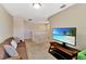 Spacious common area with sofa and TV, perfect for relaxation at 15836 Starlite St, Clermont, FL 34714