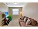 Relaxing common area with brown sofa and flat-screen TV at 15836 Starlite St, Clermont, FL 34714