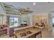 Open floor plan boasts granite kitchen island and Gathering room with a view of the backyard at 15836 Starlite St, Clermont, FL 34714