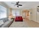Open living room with two sofas, a coffee table, and a view of the entryway at 15836 Starlite St, Clermont, FL 34714