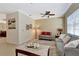 Spacious living room featuring neutral decor and a ceiling fan at 15836 Starlite St, Clermont, FL 34714