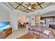 Spacious living and dining area with tray ceiling and open concept floor plan at 15836 Starlite St, Clermont, FL 34714