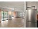 Bright living room with sliding doors to patio, hardwood floors and ceiling fan at 1701 Magnolia Ave, The Villages, FL 32159