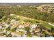 Aerial view of house near golf course and conservation area at 17112 Se 71St Lewisfield Ter, The Villages, FL 32162