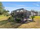 Screened patio and landscaped backyard at 17112 Se 71St Lewisfield Ter, The Villages, FL 32162