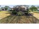 Landscaped backyard with screened patio at 17112 Se 71St Lewisfield Ter, The Villages, FL 32162