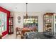 Cozy breakfast nook with table and chairs near sliding glass doors at 17112 Se 71St Lewisfield Ter, The Villages, FL 32162