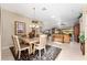 Light-filled dining room with seating for six at 17112 Se 71St Lewisfield Ter, The Villages, FL 32162