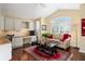 Home office features built-in cabinetry and a comfortable sitting area at 17112 Se 71St Lewisfield Ter, The Villages, FL 32162