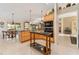 Eat-in kitchen with granite island and access to the backyard at 17112 Se 71St Lewisfield Ter, The Villages, FL 32162