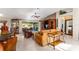 Open living room showcasing a comfortable seating area and large windows at 17112 Se 71St Lewisfield Ter, The Villages, FL 32162