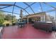 Screened patio with seating area and hot tub at 17112 Se 71St Lewisfield Ter, The Villages, FL 32162