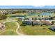 Aerial view of a neighborhood featuring golf courses and serene lakes, showcasing community at 17350 Se 116Th Court Rd, Summerfield, FL 34491