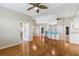 Open floor plan with living area, dining space, and kitchen featuring a breakfast bar at 17350 Se 116Th Court Rd, Summerfield, FL 34491