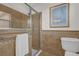 Bathroom with shower stall, toilet and tile surround at 17716 Se 85Th Ellerbe Ave, The Villages, FL 32162